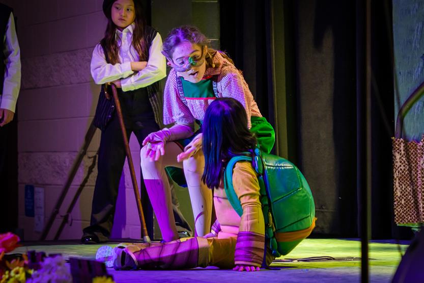 Students perform onstage